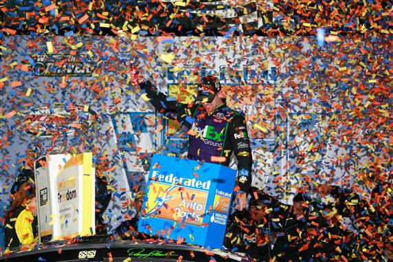 Denny Hamlin celebrates in Victory Lane after winning the NASCAR Sprint Cup Series Federated Auto Parts 400 at Richmond International Raceway