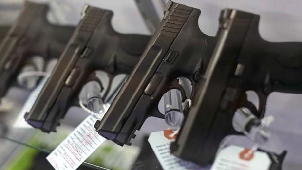 Handguns are seen for sale in a display in Bridgeton Missouri