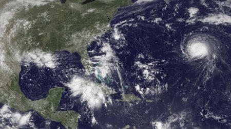 Three storm systems are shown Tropical Depression Nine to the southeast of Florida Tropical Depression Eight just off the coast of the Carolinas and Hurricane Gaston in the central Atlantic Ocean are shown in this GOES East satellite image captu