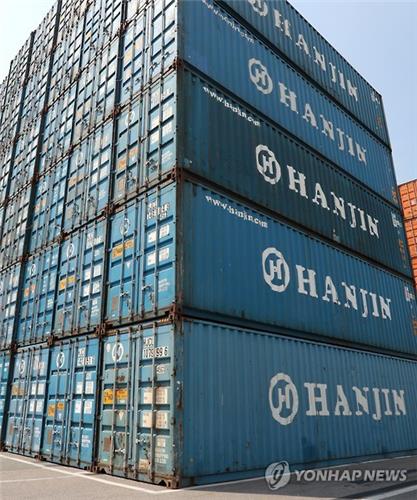 Hanjin Shipping Co.'s container boxes are stacked at a port yard in Busan on Sept. 1 2016