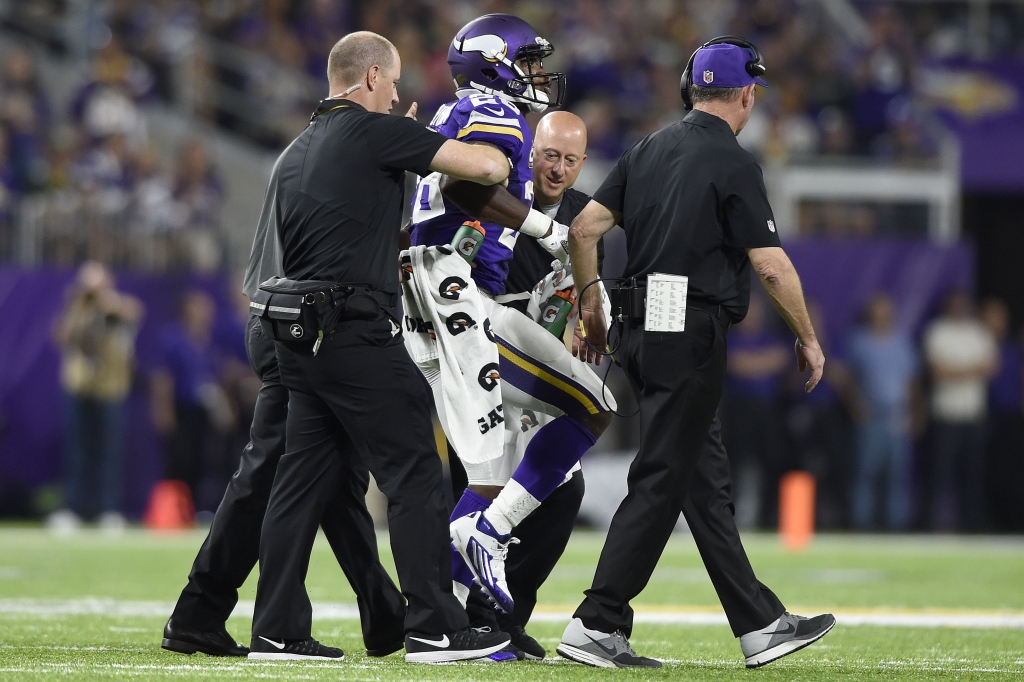 WEB Peterson helped off 091916 Vikings RB Adrian Peterson is helped off the field during Sunday's game against the Packers