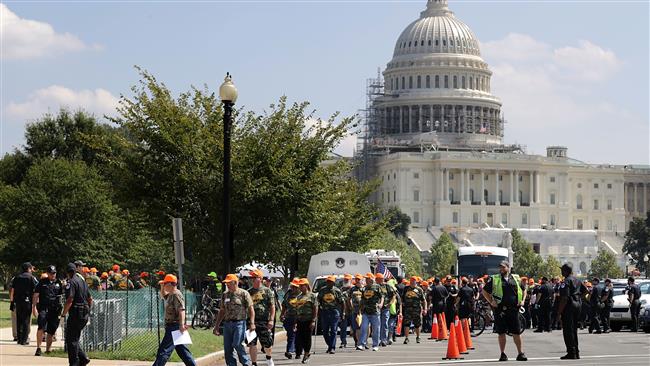 Police arrest about 100 members of the United Mine Workers of America as they block traffic near the US Capitol following a rally