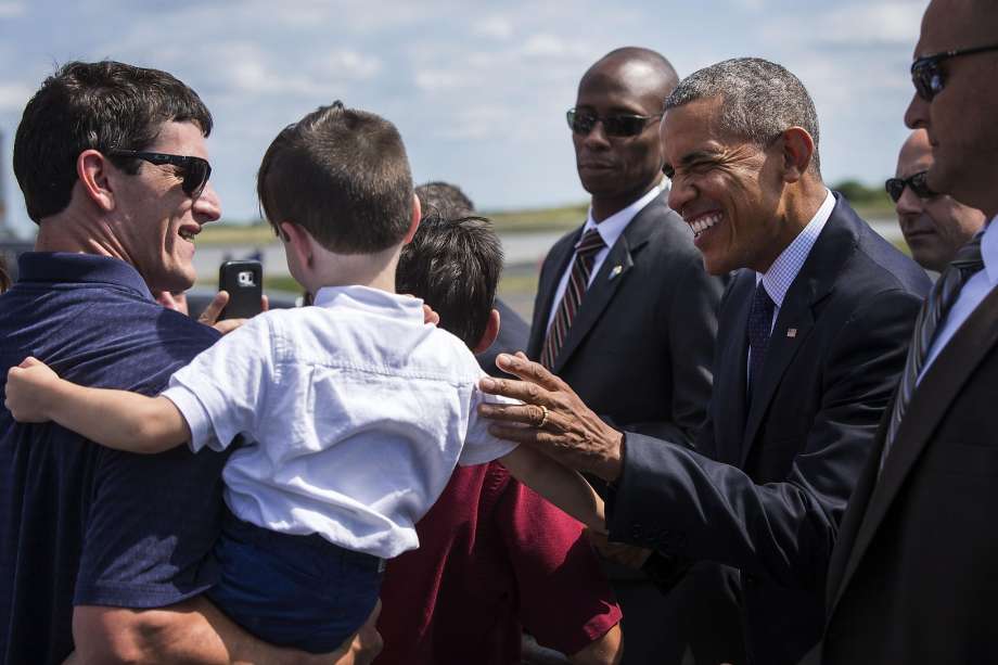 President Barack Obama greets well-wishers at the Philadelphia International Airport en route to a Hillary for America campaign event in Philadelphia Sept. 13 2016. The president also was to participate in a Democratic National Committee roundtable bef