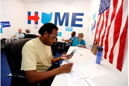 Phone volunteer James Mc Millian of Newark Ohio makes a call seeking support for Hillary Clinton at the Ohio Together Hillary Clinton campaign office in Newark Ohio Thursday Sept. 1 2016. Two months from Election Day Hillary Clinton holds a clear