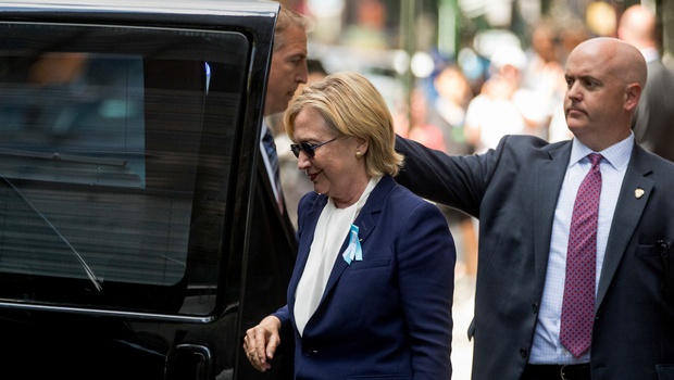 Hillary Clinton's campaign said the Democratic presidential nominee left the 9/11 anniversary ceremony in New York early after feeling overheated. | AP