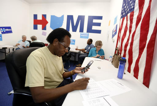 Phone volunteer James Mc Millian of Newark Ohio makes a call seeking support for Hillary Clinton at the Ohio Together Hillary Clinton campaign office in Newark Ohio Thursday Sept. 1 2016. Two months from Election Day Hilla