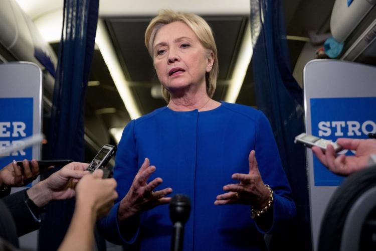 Hillary Clinton speaking to reporters Saturday night