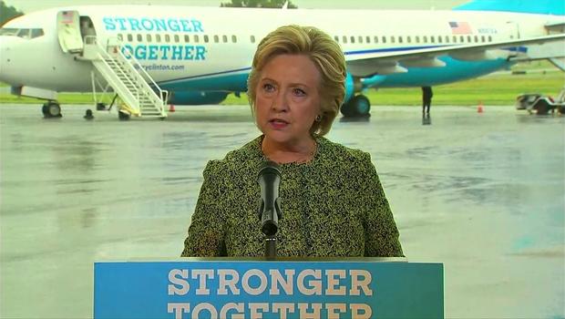 Hillary Clinton speaks to reporters on the tarmac at Westchester County Airport