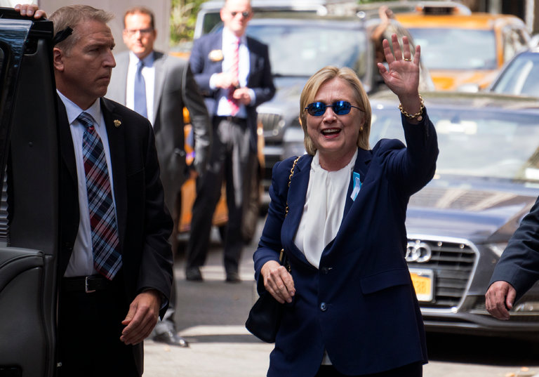 Hillary Clinton waving as she exited an apartment building on Sept. 11 in New York