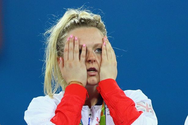 Hollie Webb reacts on the podium after defeating Netherlands in the Women's Gold Medal Match on Day 14 of the Rio 2016 Olympic Games