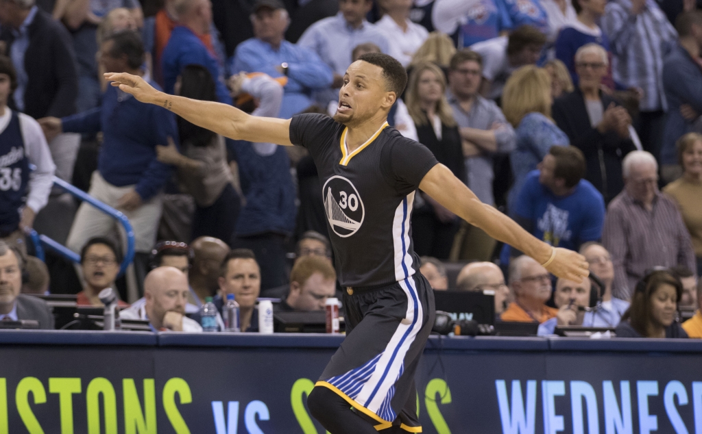 After scoring the winning three-point shot Stephen Curry #30 of the Golden State Warriors celebrates during the overtime period of a NBA game against the Oklahoma City Thunder at the Chesapeake Energy Arena