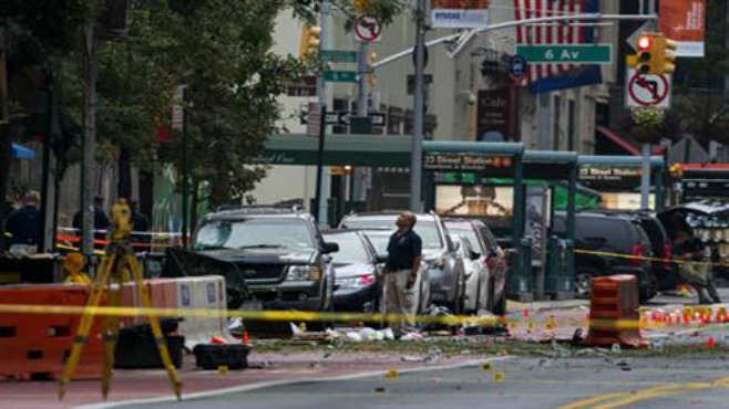 Crime scene investigators work at the scene of Saturday's explosion in Manhattan's Chelsea neighborhood in New York Sunday Sept. 18 2016