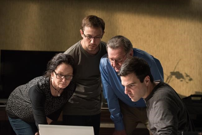 This image released by Open Road Films shows from left Melissa Leo as Laura Poitras Joseph Gordon Levitt as Edward Snowden Tom Wilkinson as Ewen Mac Askill and Zachary Quinto as Glenn Greenwald in a scene from'Snowden. (JÃ¼rgen Olczyk  Open Road Fi