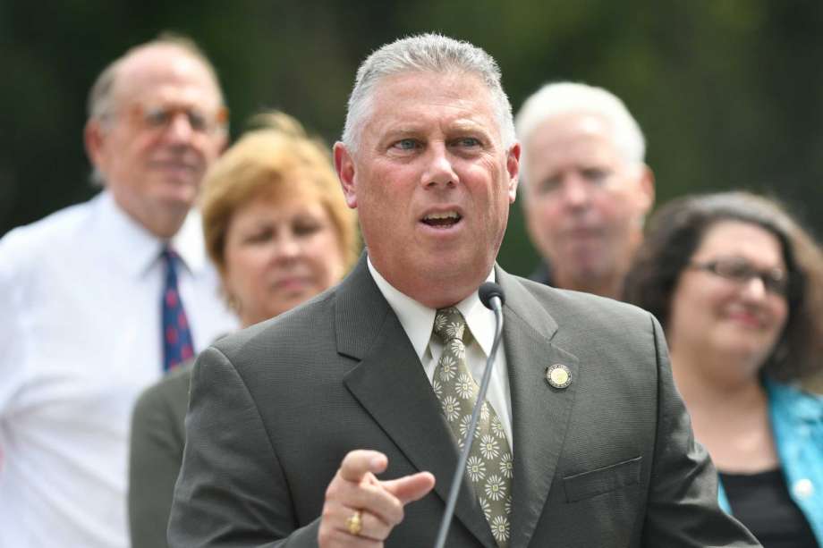 Assemblyman John T. Mc Donald III center joins officials in announcing a water infrastructure project on Wednesday Sept. 14 2016 at Woodlawn Park in Albany N.Y. Joining him from left are Chuck Houghton of the Water Board and Albany Common Council