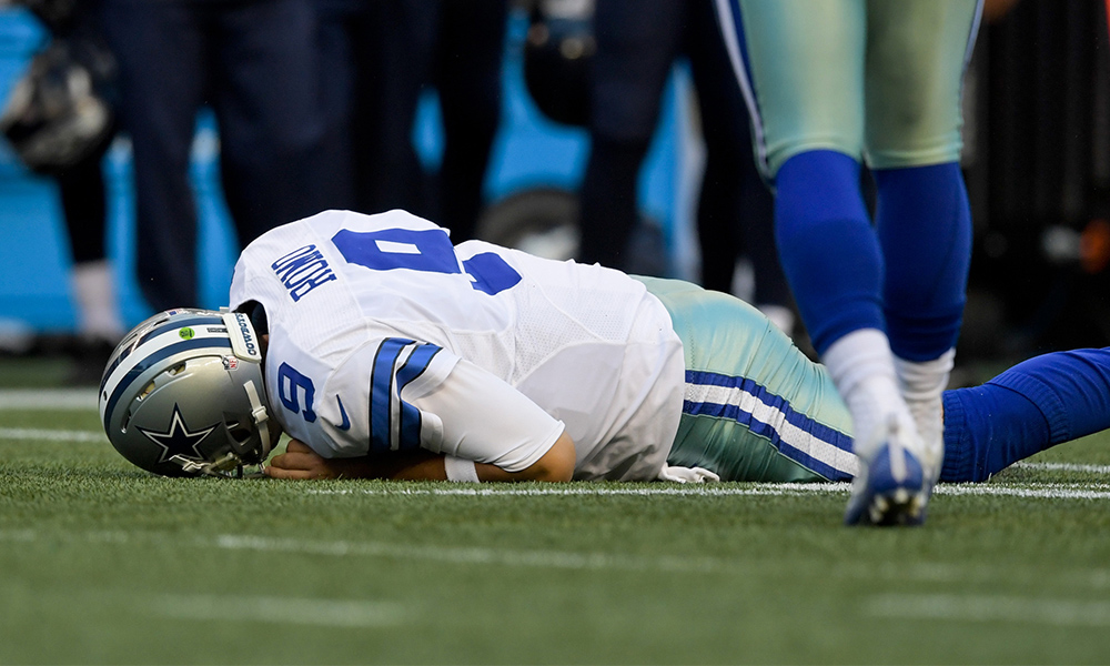 Aug 25 2016 Seattle WA USA Dallas Cowboys quarterback Tony Romo lies on the field after he is tackled by Seattle Seahawks defensive end Cliff Avril during the first half of an NFL football game at Century Link Field. Mandatory Credit Kirby L