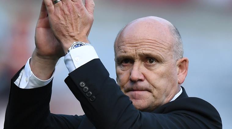 Hull City caretaker manager Mike Phelan applauds the fans at the end of the match. Reuters