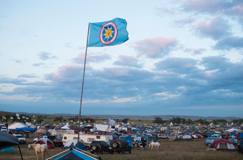 A Standing Rock Sioux flag flies over a protest encampment near Cannon Ball North Dakota where members of the Standing Rock Sioux tribe and their supporters have gathered to voice their opposition to the Dakota Access oil Pipeline