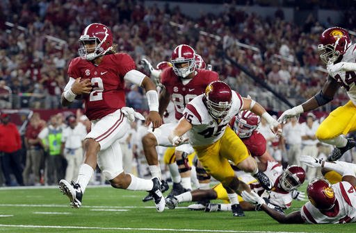 Alabama quarterback Jalen Hurts slips into the end zone on a 7-yard touchdown run during the second half of an NCAA college football game against Southern California on Saturday Sept. 3 2016 in Arlington Texas