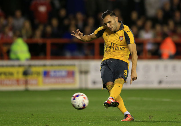 Arsenal's Lucas Perez scores his side's second goal of the game from a penalty during the English League Cup Third Round soccer match between Nottingham For