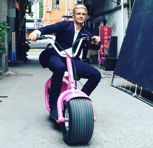 Orlando Bloom blonde on bike