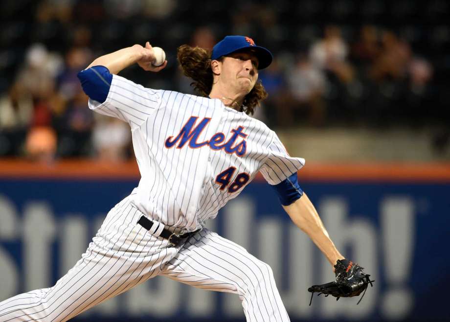 New York Mets starting pitcher Jacob de Grom delivers against the Miami Marlins in the first inning of a baseball game Thursday Sept. 1 2016 in New York