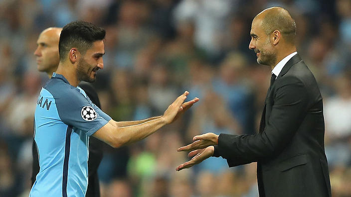 Ilkay Gundogan and Pep Guardiola.            
    
              
     
     
           Show Grid