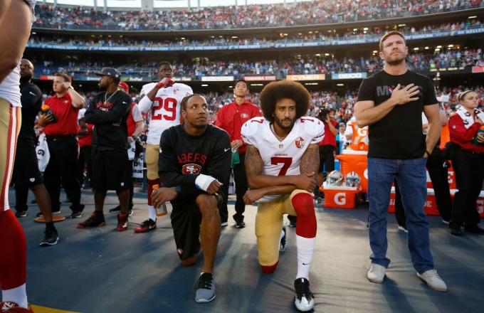 Colin Kaepernick kneels during the national anthem before a preseason game