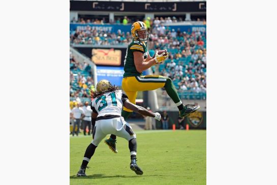 Green Bay Packers wide receiver Jordy Nelson right catches a pass in front of Jacksonville Jaguars cornerback Davon House during the second half of an NFL football game in Jacksonville Fla. Sunday Sept. 11 2016