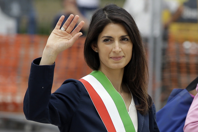 Rome's Mayor Virginia Raggi waves to reporters as she leaves the Rome's Vittoriano Unknown soldier monumen