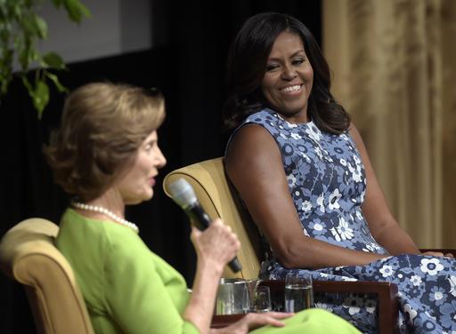 First lady Michelle Obama listens as former first lady Laura Bush speaks during the'America's First Ladies In Service to Our Nation conference at the National Archives in Washington Friday Sept. 16 2016