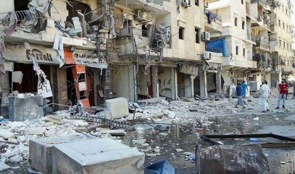 Syrian Civil Defense White Helmets men stand in rubble after recent airstrikes on Aleppo