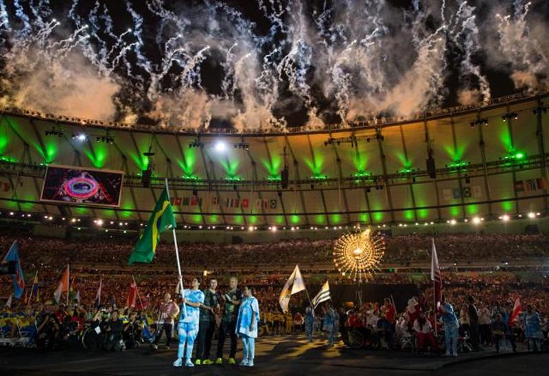 IOC football 5-a-side player Ricardinho of Brazil carries in his country’s flag