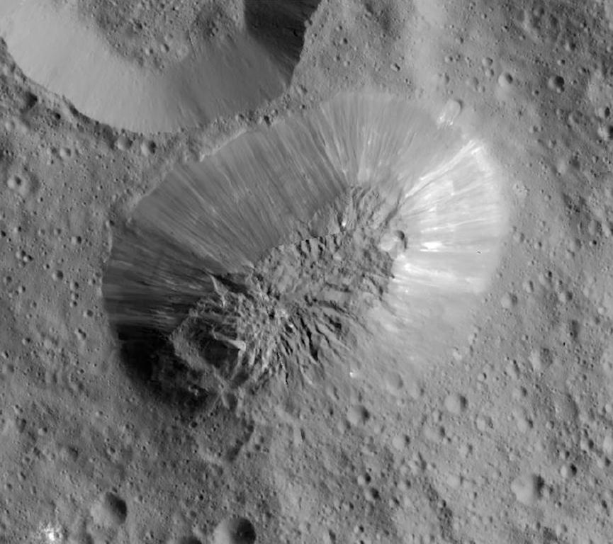 This image provided by NASA shows an inactive volcano on the surface of Ceres the largest object in the asteroid belt between Mars and Jupiter. Scientists said the volcano on the dwarf planet Ceres is about half as tall as Mount Everest. (NASA  JPL-Caltec