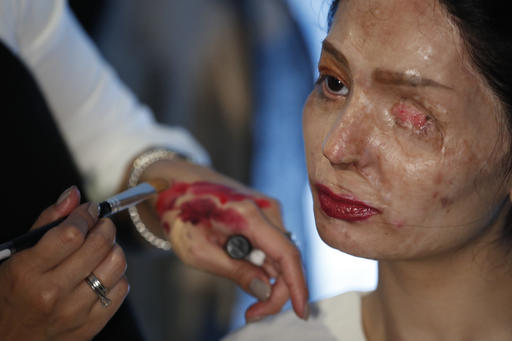 Model and acid attack victim Reshma Querishi has her make up and hair done before walking the runway for the Archana Kochhar collection during Fashion Week in New York Thursday Sept. 8 2016