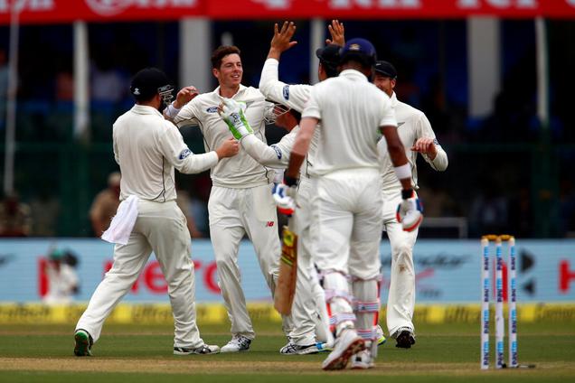 New Zealand's Mitchell Santner celebrates with teammates after taking the wicket of Lokesh Rahul in the first test being played at the Eden Park Stadium in Kanpur.- Reuters