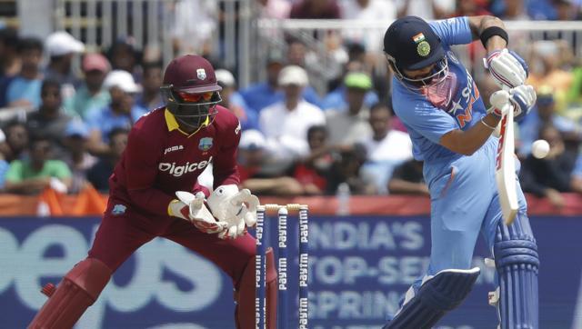 India's Virat Kohli right plays a shot as West Indies Andre Fletcher looks