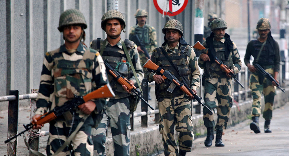 Indian Border Security Force soldiers patrol a street in Srinagar as the city remains under curfew following weeks of violence in Kashmir