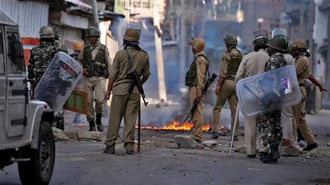 Indian policemen are seen during a protest in Kashmir’s main city of Srinagar