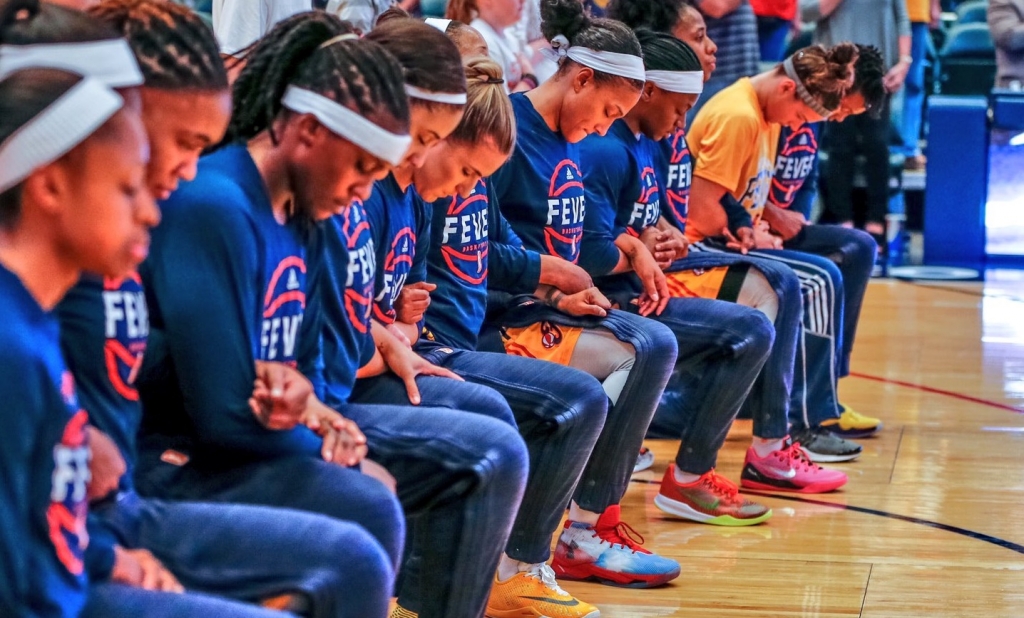 Indiana Fever players kneel during the national anthem on Sept. 21 2016