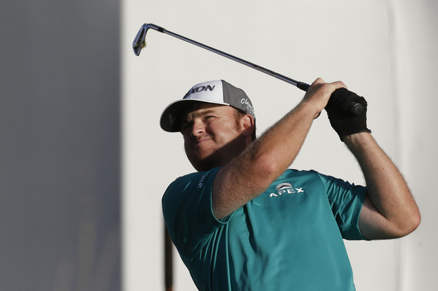 J.B. Holmes watches his shot off the tee of the 17th hole during the third round of the BMW Championship golf tournament at Crooked Stick Golf Club in Carmel