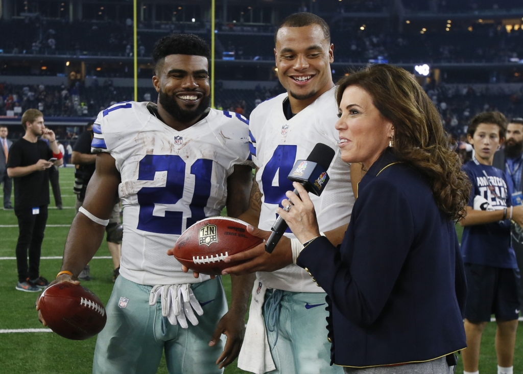 Sep 25 2016 Arlington TX USA Dallas Cowboys running back Ezekiel Elliott and quarterback Dak Prescott talk with NBC sideline reporter Michele Tafoya after the game against the Chicago Bears at AT&T Stadium. Dallas won 31-17. Mandatory Credit