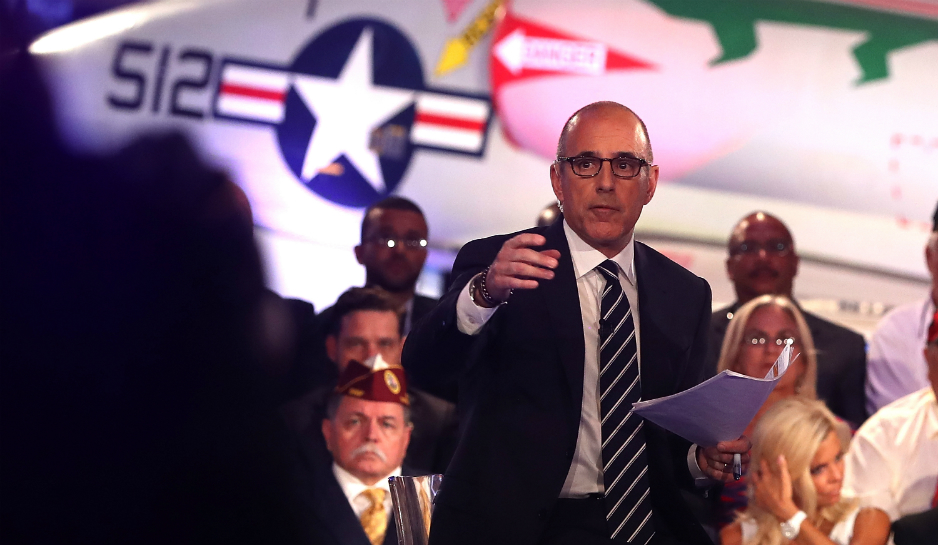 Interviewer Matt Lauer takes audience questions for presidential candidates