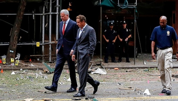 New York Mayor Bill de Blasio and New York Governor Andrew Cuomo tour the site of an explosion that occurred on Saturday night in the Chelsea neighborhood of New York USA