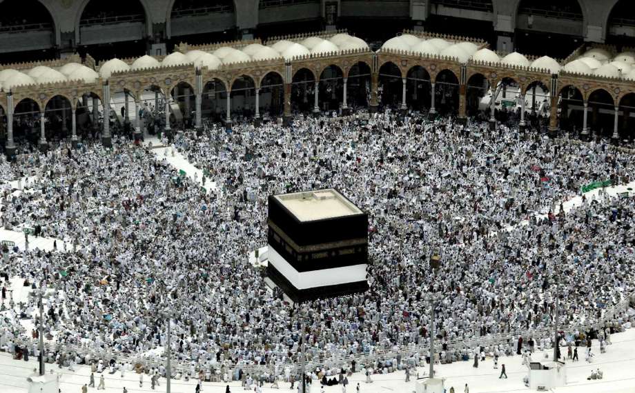 Muslim pilgrims prepare themselves for Friday prayers in front of the Kaaba Islam's holiest shrine at the Grand Mosque in the Muslim holy city of Mecca Saudi Arabia Friday Sept. 9 2016. Muslim pilgrims have begun arriving at the holiest sites in Isl