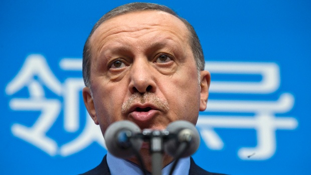 Turkey's President Recep Tayyip Erdogan speaks at a press conference held at the end of the G-20 summit in Hangzhou in eastern China's Zhejiang province Monday Sept. 5 2016. Chinese characters at the back reads