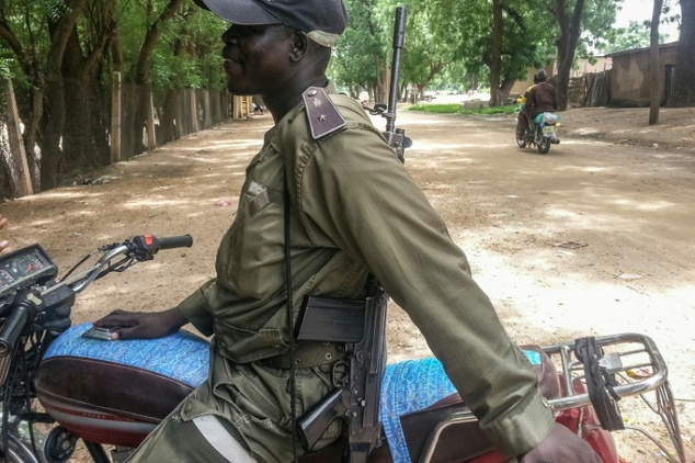 A Cameroonian policeman patrols in Kourgui in the extreme northern province west of the Nigerian border