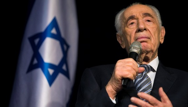 Israel's President Shimon Peres speaks to the media during a news conference in the southern town of Sderot