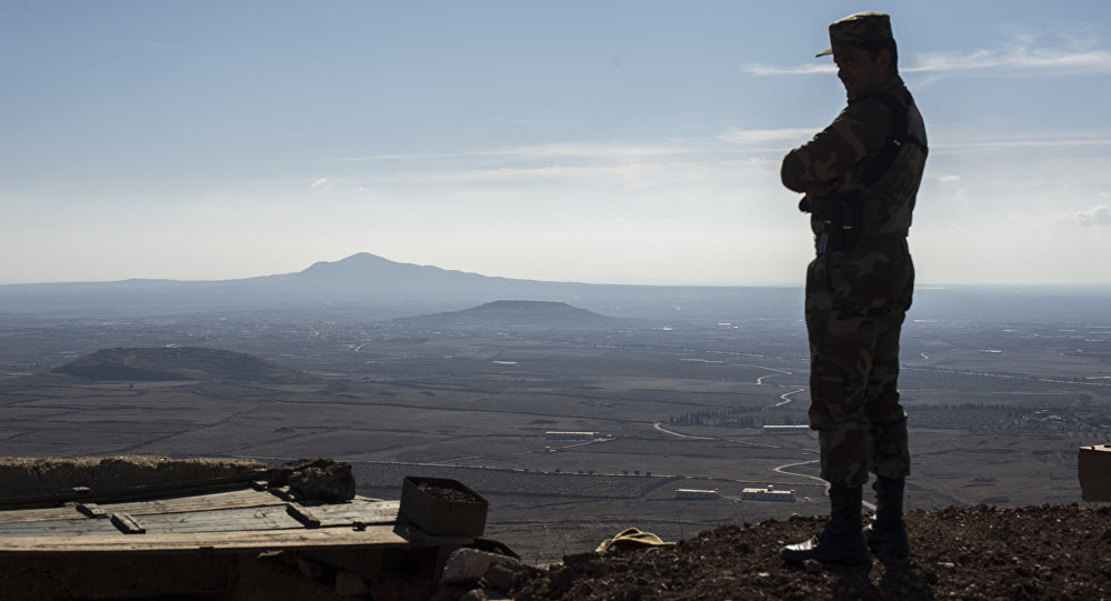 A soldier of the Syrian Arab Army at an observation post at the frontline in the al Kom village of the Quneitra province in Syria