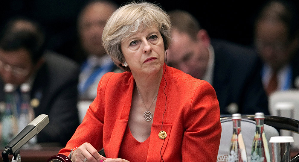 Britain's Prime Minister Theresa May listens to the speech of China's President Xi Jinping during the opening ceremony of the G20 Summit in Hangzhou China