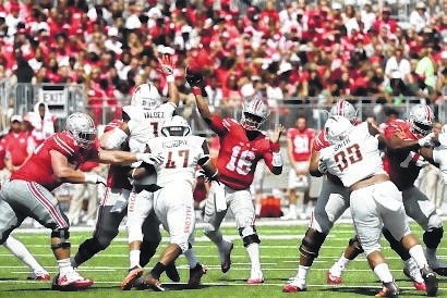 J.T. Barrett throws a pass against Bowling Green. A strong game from Barrett might be a necessity for Ohio State at Oklahoma on Saturday night